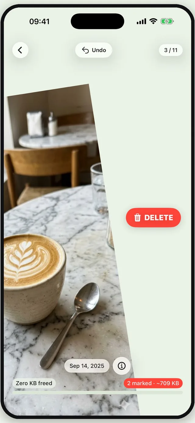 The cleaning screen: a cafe photo full-bleed, with a red DELETE marker on the right